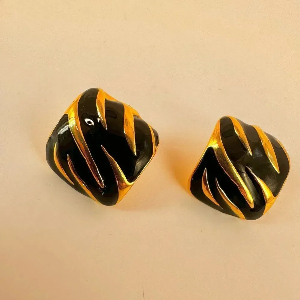 Gold tone and black square post earrings